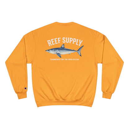 Back view of a Reef Supply orange crewneck sweatshirt featuring a mako shark graphic.