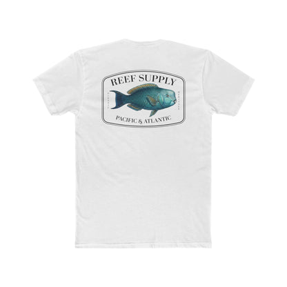 A close-up view of the back of a white premium cotton t-shirt. The centerpiece is a detailed, vibrant illustration of a blue Parrotfish, reflecting its natural colors. The Reef Supply brand logo is arched over the top of the fish, with 'Pacific & Atlantic' text printed in a clean font beneath it, highlighting our coastal inspiration