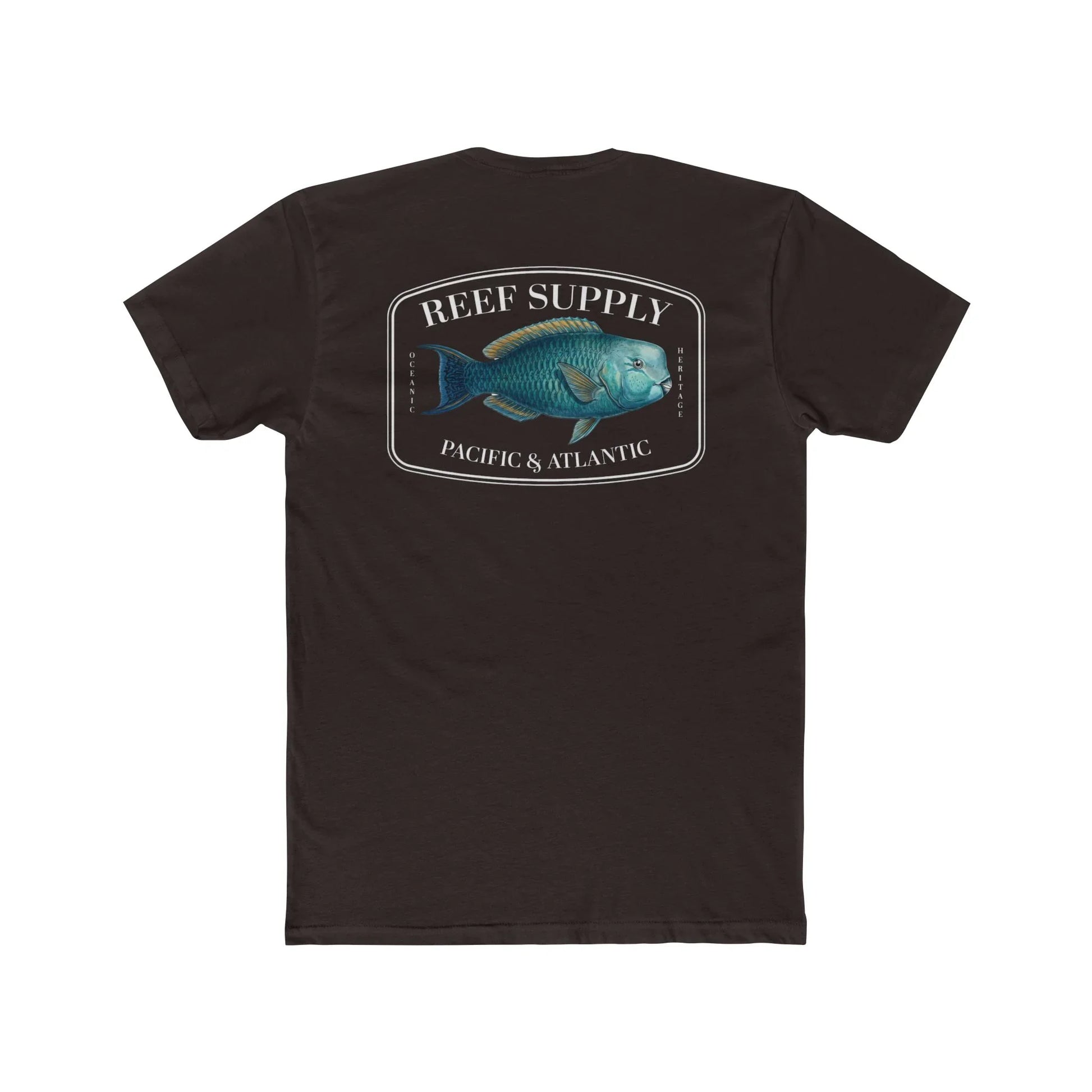 A close-up view of the back of a brown premium cotton t-shirt. The centerpiece is a detailed, vibrant illustration of a blue Parrotfish, reflecting its natural colors. The Reef Supply brand logo is arched over the top of the fish, with 'Pacific & Atlantic' text printed in a clean font beneath it, highlighting our coastal inspiration