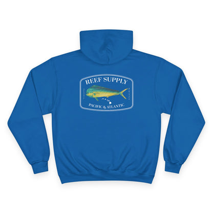 The back of a premium Champion blue pullover hoodie, crafted for those who respect the sea. It features a bold, high-definition print of a vibrant Mahi Mahi—a tribute to the thrill of the offshore hunt. Paired with 'Reef Supply' coastal branding and the iconic 'Pacific & Atlantic' call-out, this Champion-quality garment delivers the durability needed for the marina and the style of a dedicated angler