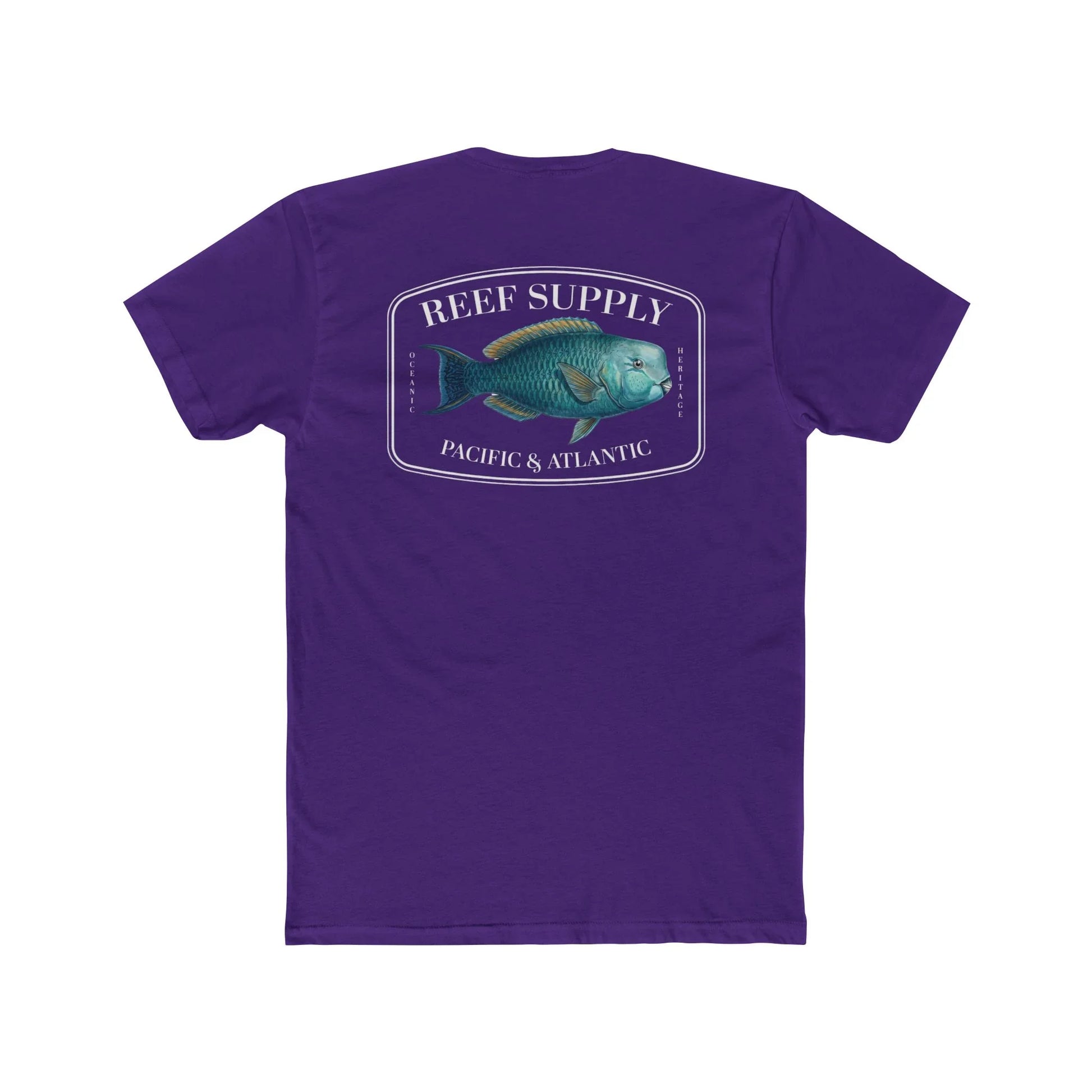 A close-up view of the back of a purple premium cotton t-shirt. The centerpiece is a detailed, vibrant illustration of a blue Parrotfish, reflecting its natural colors. The Reef Supply brand logo is arched over the top of the fish, with 'Pacific & Atlantic' text printed in a clean font beneath it, highlighting our coastal inspiration