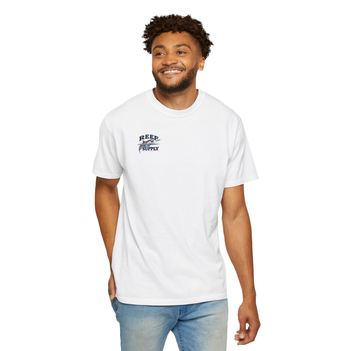 Man wearing a white Reef Supply Tiger Tee t-shirt with a shark graphic.