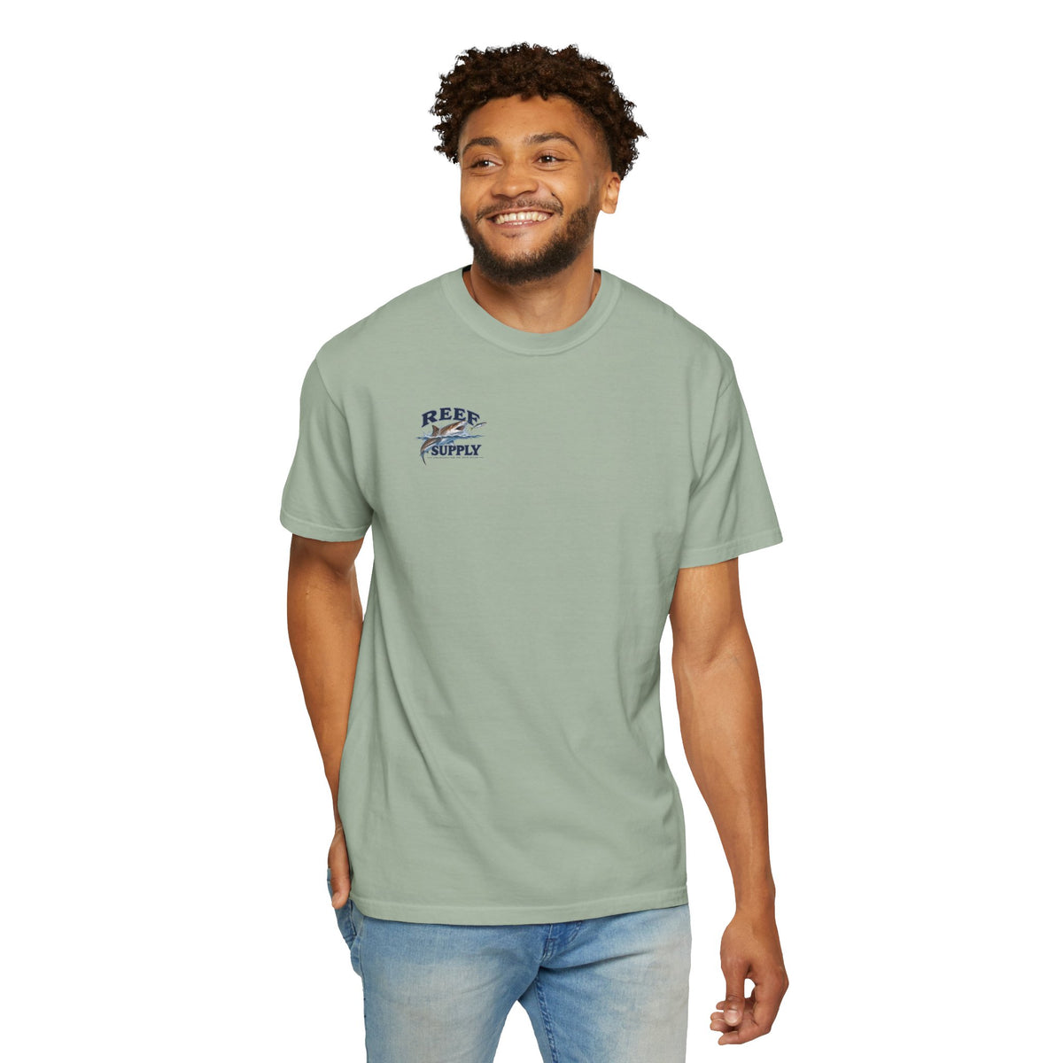 Man wearing a light green Reef Supply Tiger Tee t-shirt with a shark logo.