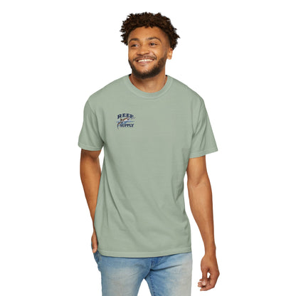 Man wearing a light green Reef Supply Tiger Tee t-shirt with a shark logo.