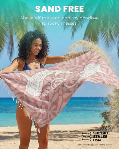 Woman holding a Sand Free Pink Whale Shark Beach towel 