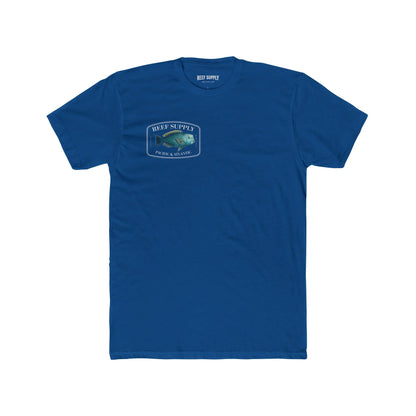 A close-up view of the front of a royal blue premium cotton t-shirt. The centerpiece is a detailed, vibrant illustration of a blue Parrotfish, reflecting its natural colors. The Reef Supply brand logo is arched over the top of the fish, with 'Pacific & Atlantic' text printed in a clean font beneath it, highlighting our coastal inspiration