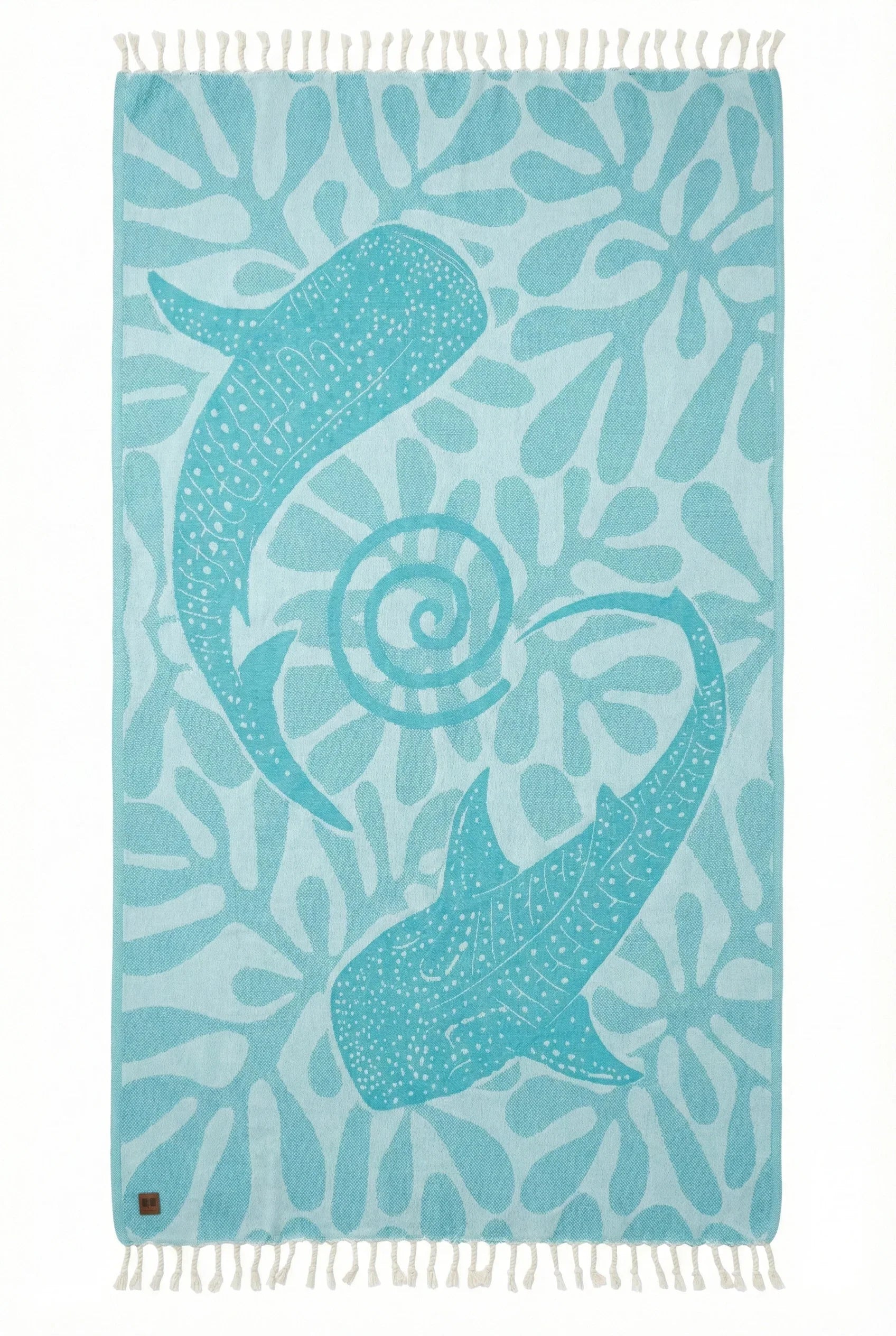 Towel with a whale shark design on a blue background