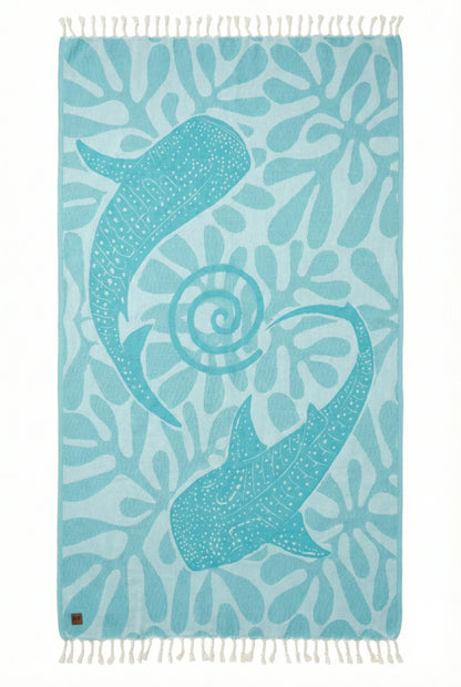 Towel with a whale shark design on a blue background