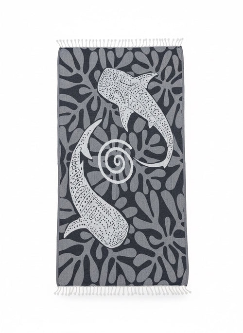 Towel with shark and coral pattern on a dark background