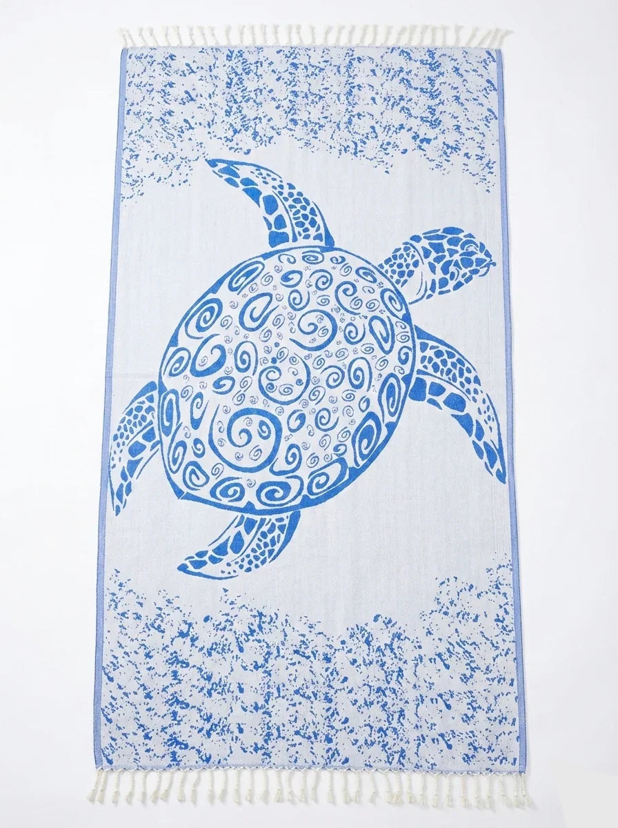 Towel with a blue turtle design on a white background