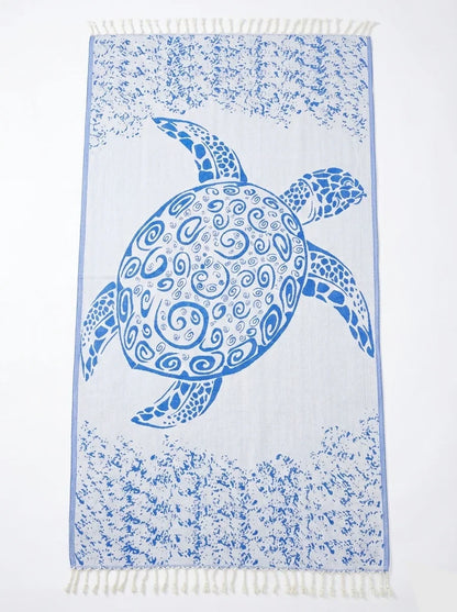 Towel with a blue turtle design on a white background